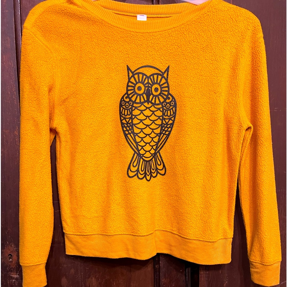 Golden light weight sweater with an Owl in black on front of sweater. Size M